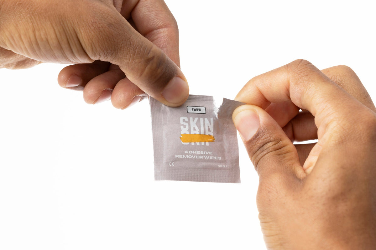 Using a Skin Grip remover wipe to lift a CGM patch